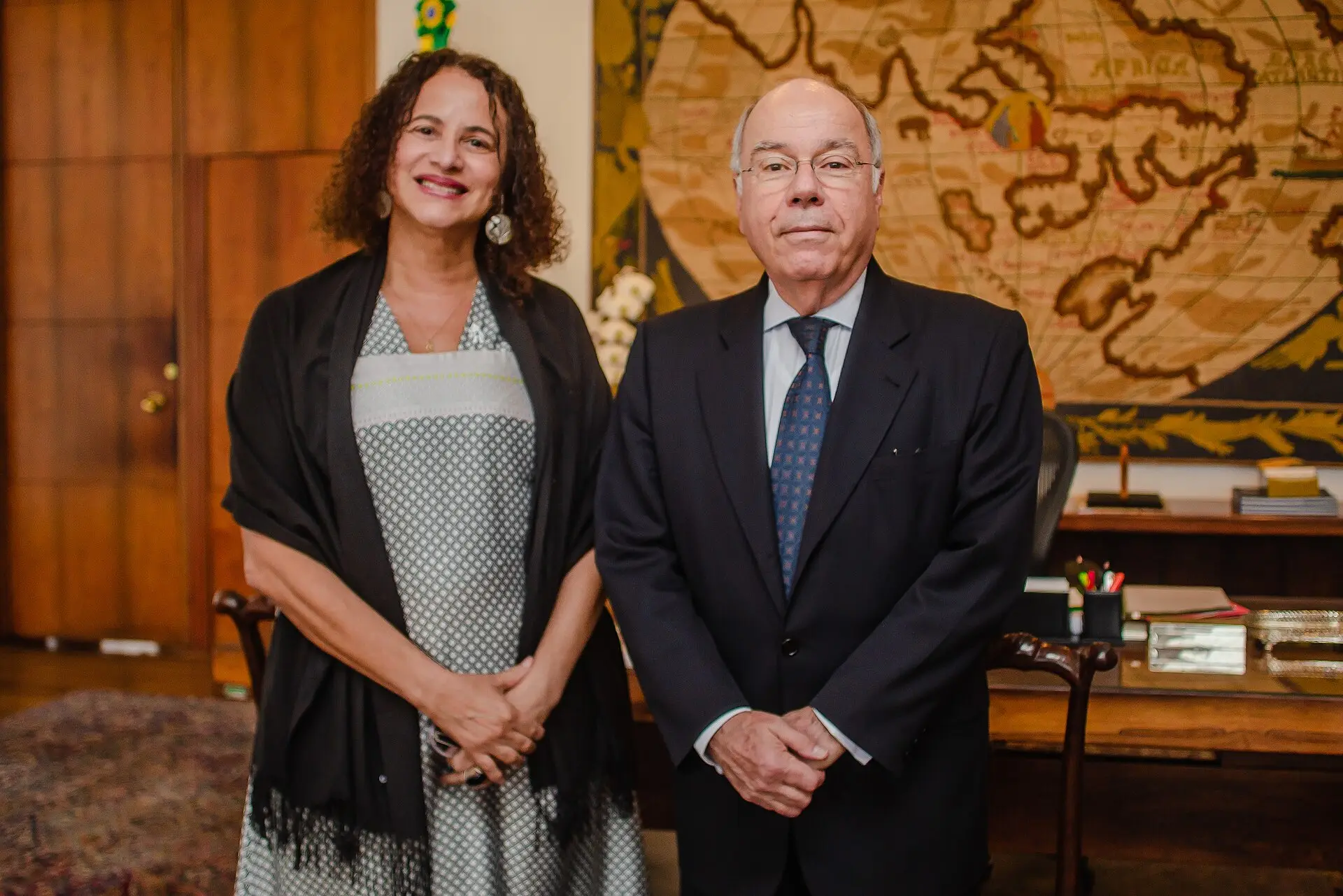 Brazil's foreign minister Mauro Vieira stands beside a colleague in an office at the Itamaraty Palace.