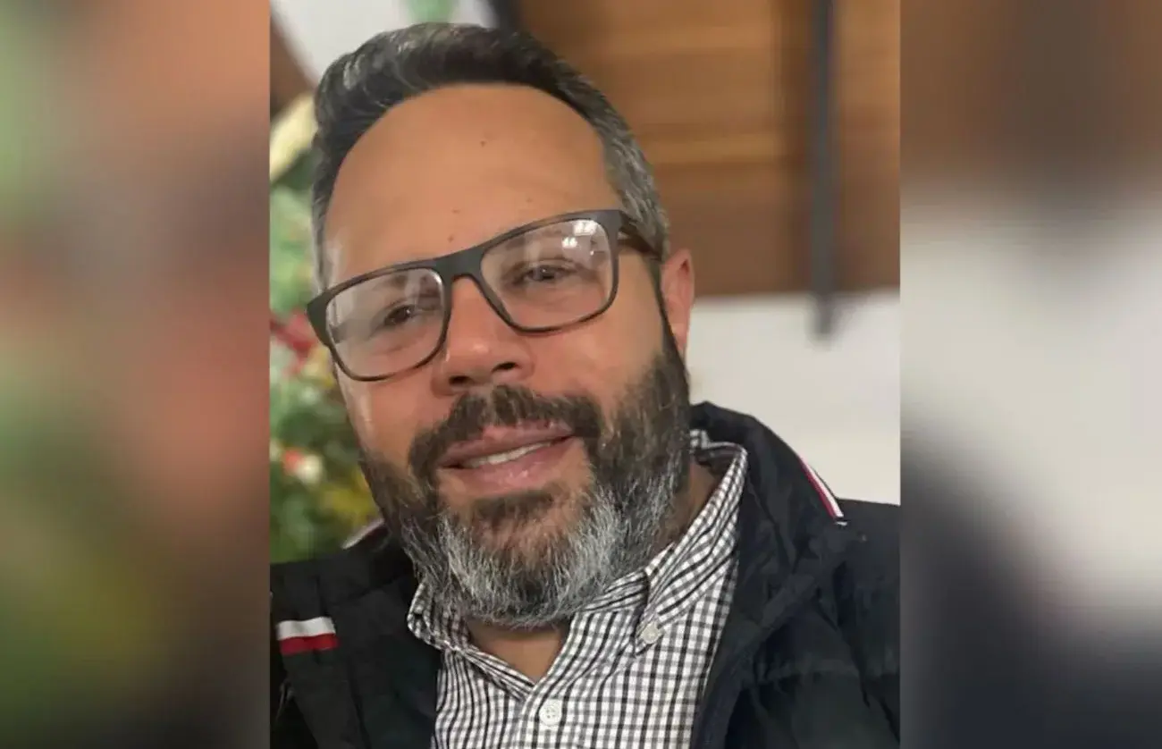 Rafael Tudares, wearing glasses and a checked shirt, in a close-up photo.